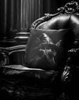 Cat Peekaboo pillow by Muahaha!  Black and white photo of the 16x16 faux suede pillow showing a cat wearing a witch hat's face resting on an antique arm chair in a victorian mansion.  The perfect Halloween gift!