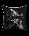 A gif shows Cat Peekaboo Pillow animating from front to back.  On the front is a closeup of a cat wearing a witch hat with its hands covering his face.  Flip the pillow to reveal the cat's cute face meowing.  Black and white artwork on a 16x16 faux suede pillow.  The perfect spooky, Halloween gift!