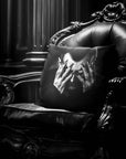 Dracula Peekaboo pillow by Muahaha!  Black and white photo of the 16x16 faux suede pillow showing Dracula's face resting on an antique arm chair in a victorian mansion.  The perfect Halloween gift!