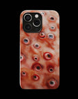 Eyesore Monster Flesh phone case!  For iPhone, Samsung Galaxy, and Google Pixel devices.  Muhahaha! presents the perfect spooky, Halloween gift.  Every case has double layers for extra durability and protection while the clear, open ports stay out of your way when it comes to charging. Choose between matte or glossy finish. (pictured: iPhone 15 pro rocking an Eyesore Monster Flesh phone case)