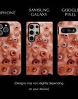 Eyesore Monster Flesh Tough Phone cases from Muahaha!  Pictured: iPhone 16 Max, Samsung Galaxy S24 Ultra, Google Pixel 8 Pro.  Designs may vary slightly depending on your device.