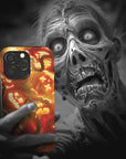 A zombie takes a selfie with a Jack-O'-Lantern Monster Flesh phone case!  Available for iPhone, Samsung Galaxy, and Google Pixel devices.  Muhahaha! presents the perfect spooky, Halloween gift.  Every case has double layers for extra durability and protection while the clear, open ports stay out of your way when it comes to charging. Choose between matte or glossy finish. (pictured: iPhone 15 pro with a Jack-O'-Lantern Monster Flesh phone case)