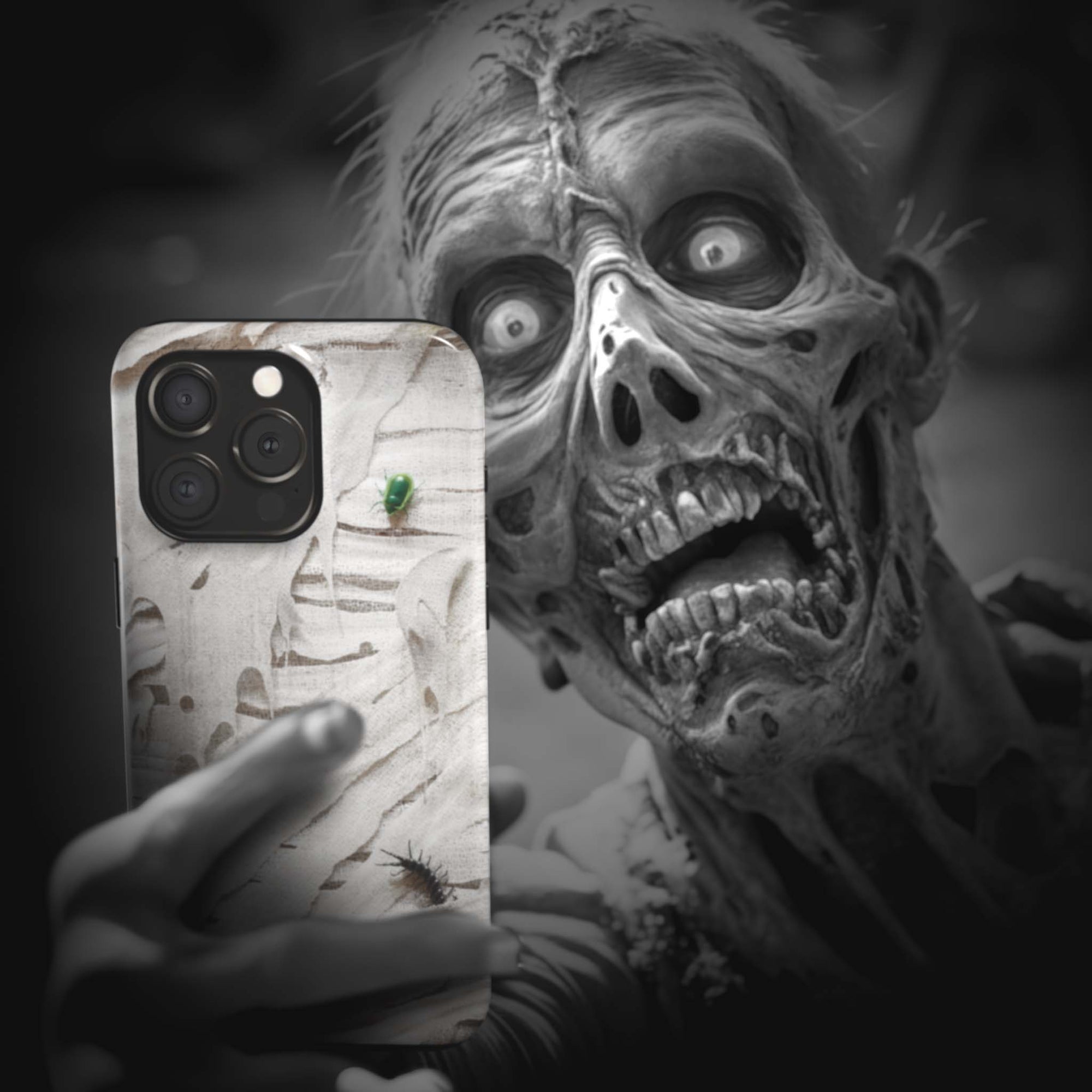 A zombie takes a selfie with a Mummy Monster Flesh phone case!  Available for iPhone, Samsung Galaxy, and Google Pixel devices.  Muhahaha! presents the perfect spooky, Halloween gift.  Every case has double layers for extra durability and protection while the clear, open ports stay out of your way when it comes to charging. Choose between matte or glossy finish. (pictured: iPhone 15 pro with a Mummy Monster Flesh phone case)