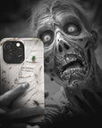 A zombie takes a selfie with a Mummy Monster Flesh phone case!  Available for iPhone, Samsung Galaxy, and Google Pixel devices.  Muhahaha! presents the perfect spooky, Halloween gift.  Every case has double layers for extra durability and protection while the clear, open ports stay out of your way when it comes to charging. Choose between matte or glossy finish. (pictured: iPhone 15 pro with a Mummy Monster Flesh phone case)