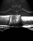 Werewolf Peekaboo pillow by Muahaha!  Black and white photo of the 16x16 faux suede pillow showing a Werewolf's face resting on an antique bed in a victorian mansion.  The perfect gothic, horror gift!