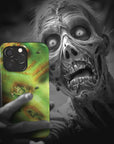 A zombie takes a selfie with a Zombie Monster Flesh phone case!  Available for iPhone, Samsung Galaxy, and Google Pixel devices.  Muhahaha! presents the perfect spooky, Halloween gift.  Every case has double layers for extra durability and protection while the clear, open ports stay out of your way when it comes to charging. Choose between matte or glossy finish. (pictured: iPhone 15 pro with a Zombie Monster Flesh phone case)