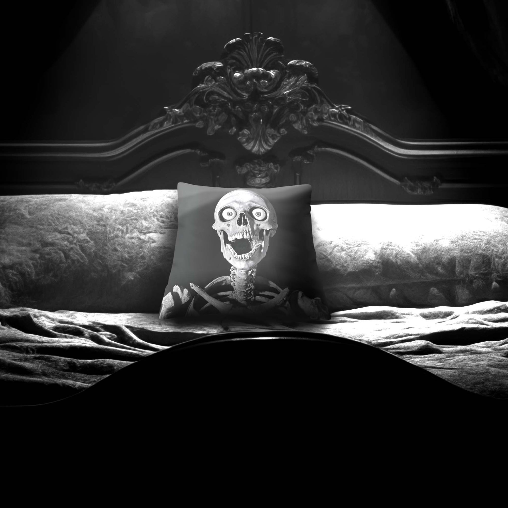 Skeleton Peekaboo pillow by Muahaha!  Black and white photo of the 16x16 faux suede pillow showing a skeleton's face resting on an antique bed in a victorian mansion.  The perfect gothic, horror gift!